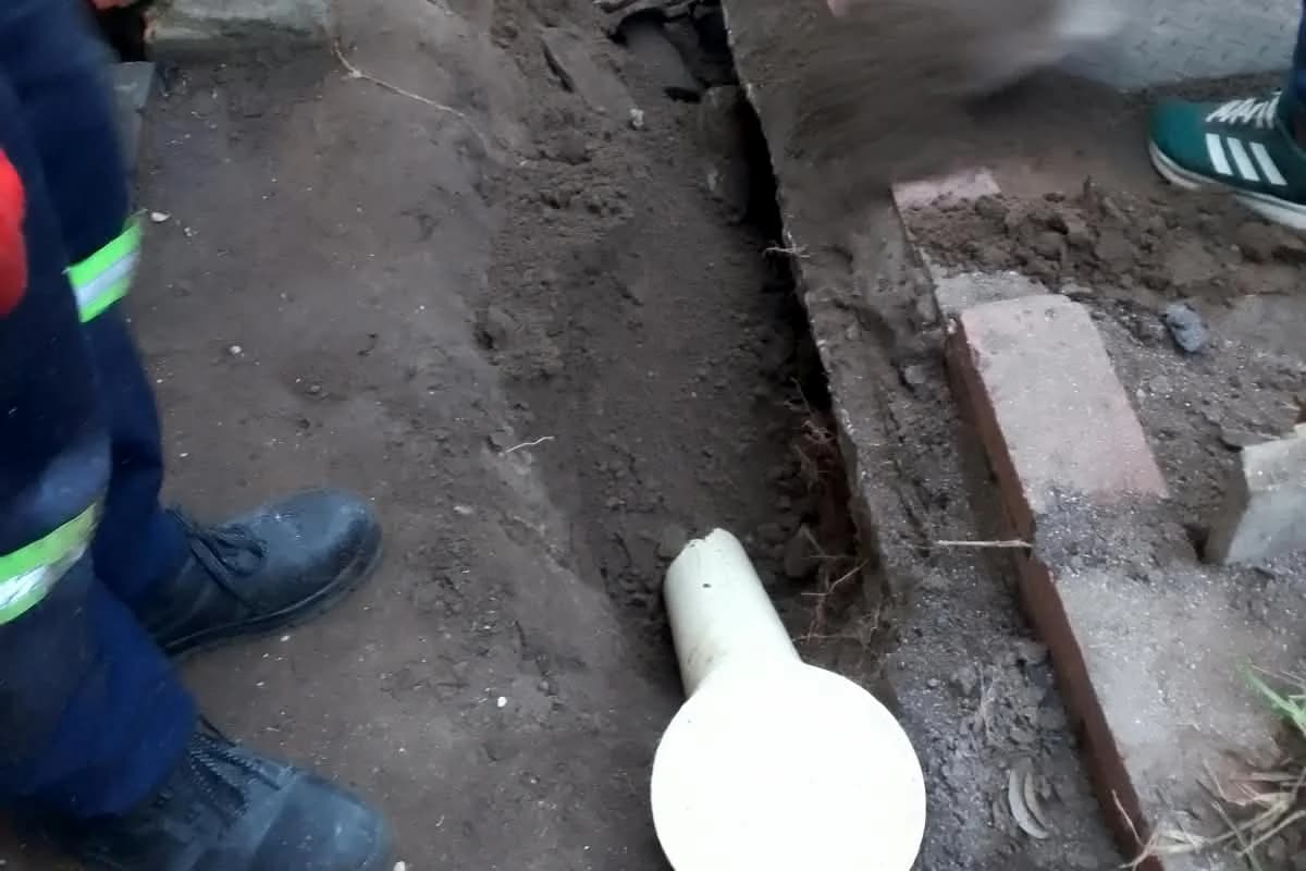 Drain line dug open by the Sniper Plumbing team for repair