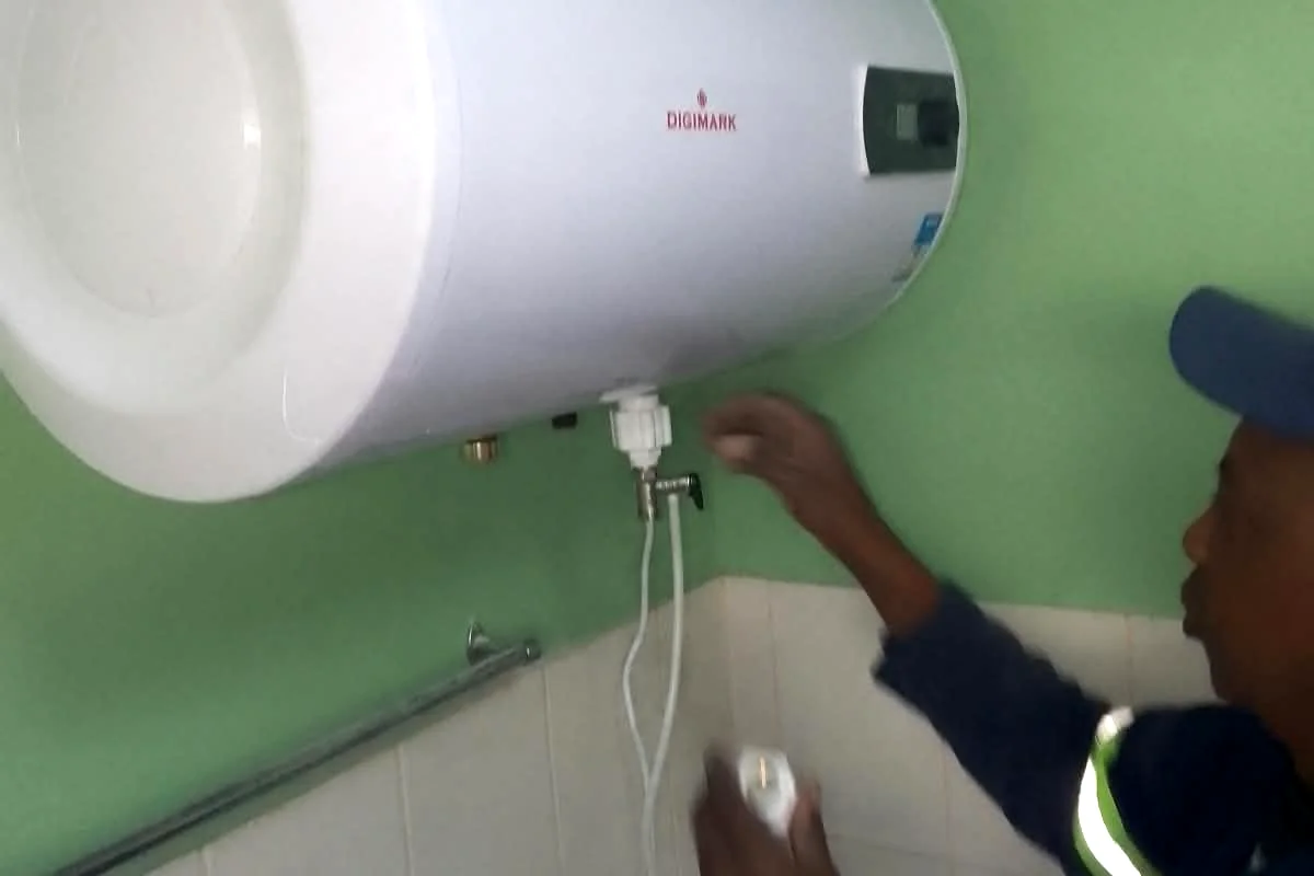 Sniper Plumbing technician servicing an electric geyser