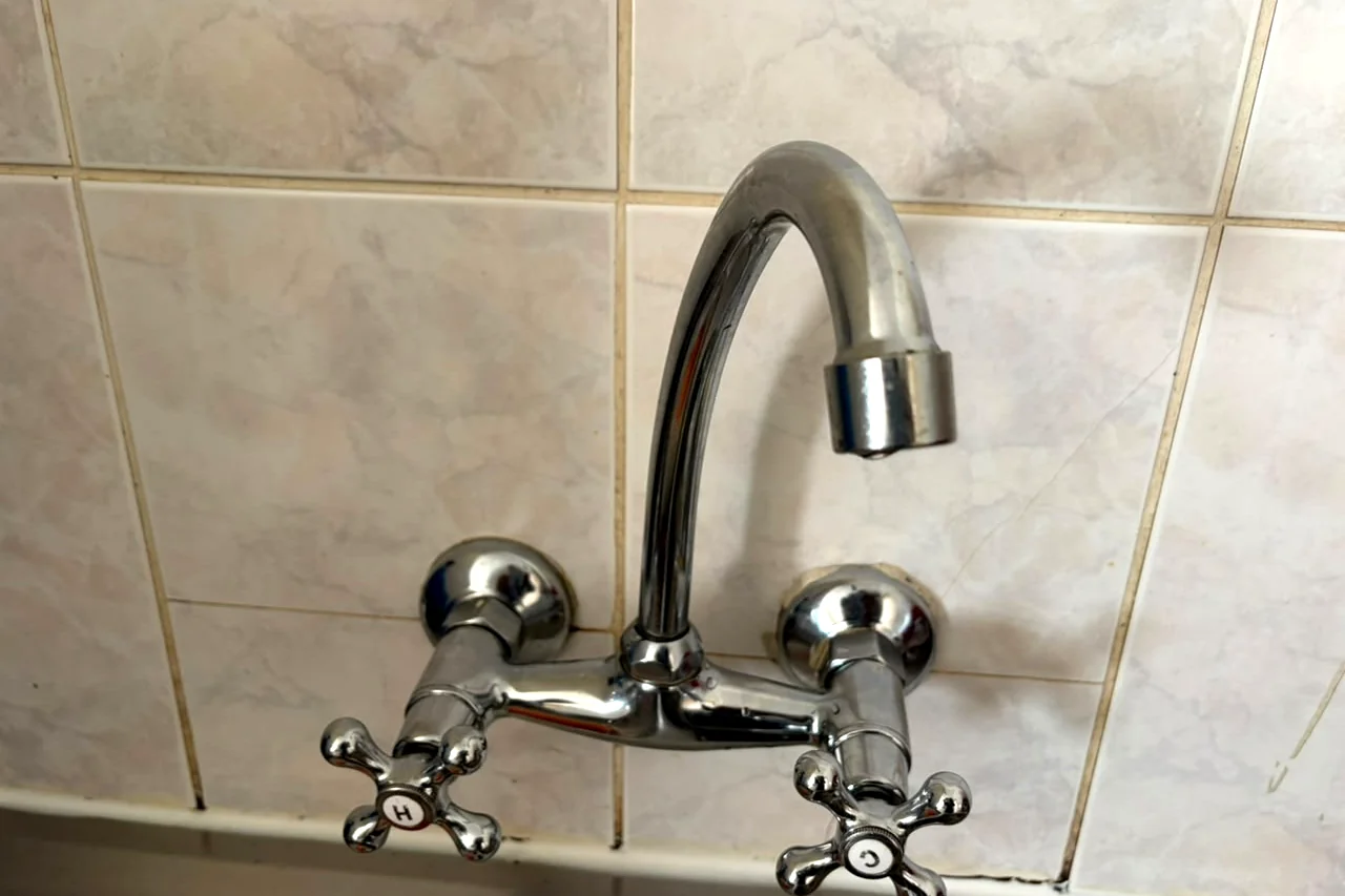 New wall-mounted kitchen tap fitted by Sniper Plumbing
